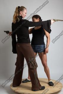 2021 01 OXANA AND XENIA STANDING POSE WITH GUNS 2 (4)